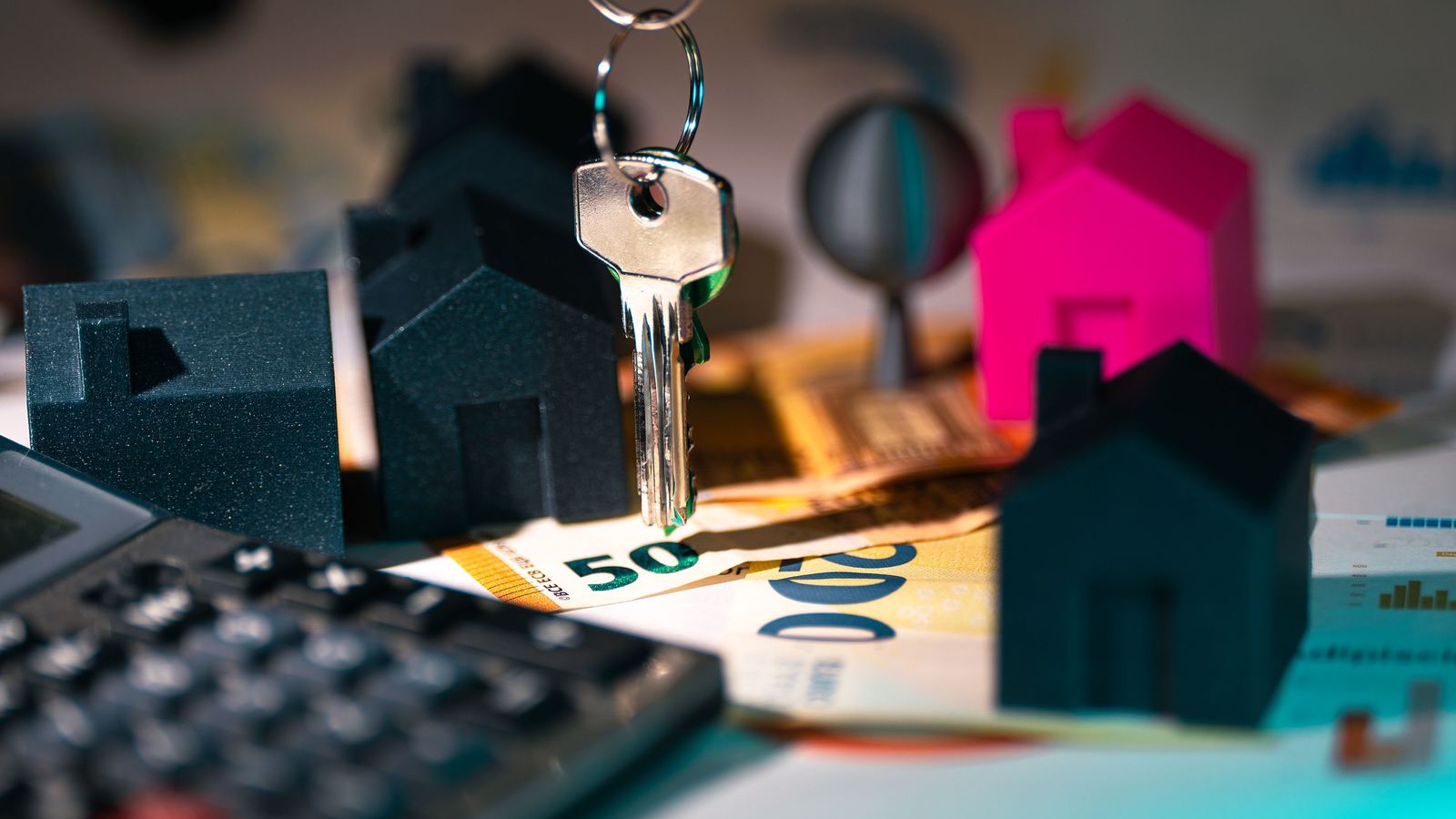 House keys and paperwork on a desk