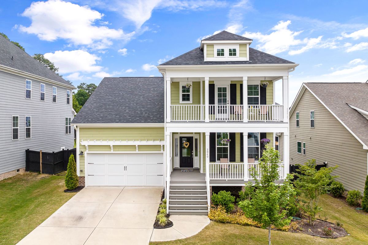 New construction home with double porches